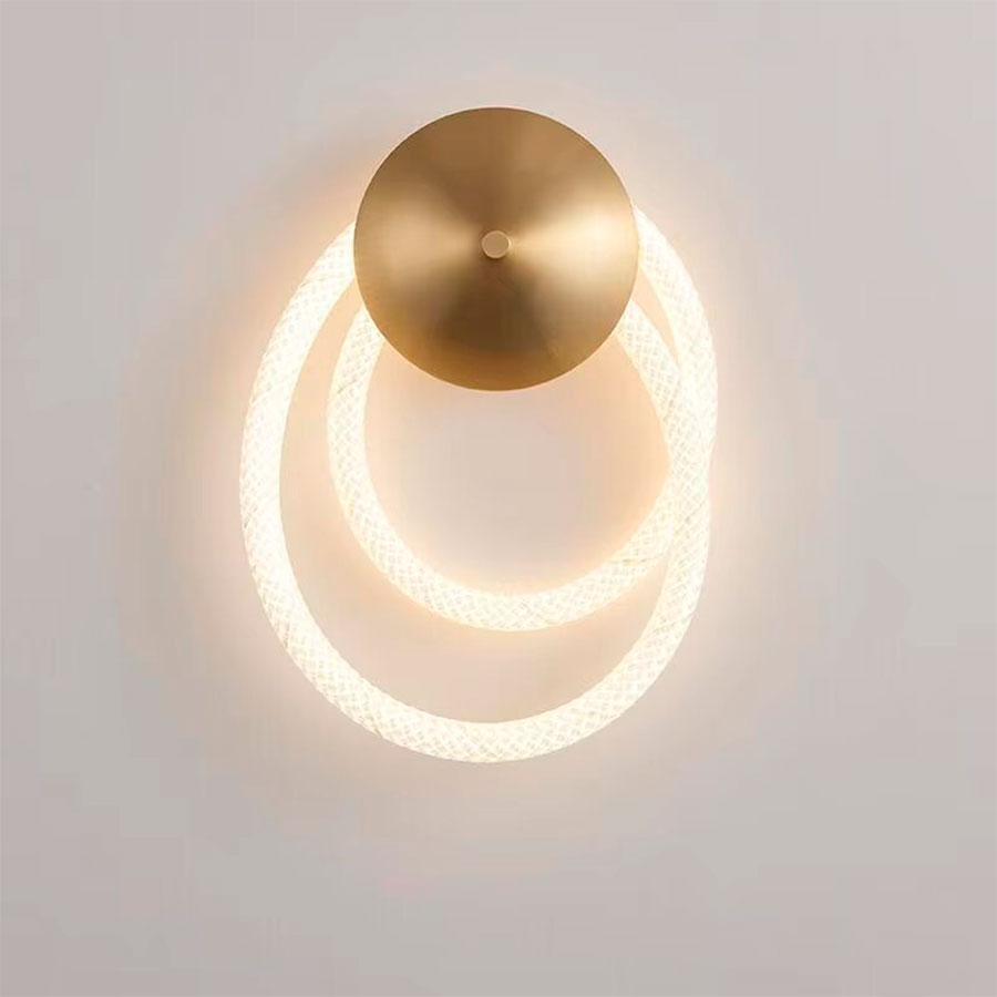 Lámpara led de pared Loop brass con luz cálida